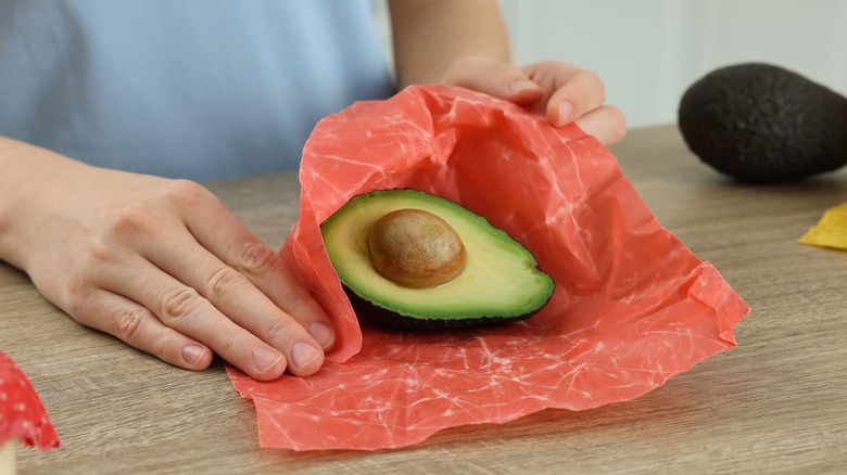 Wrapping avocado in paper