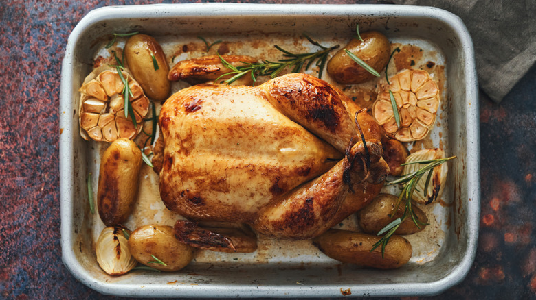 Whole roasted chicken in a pan