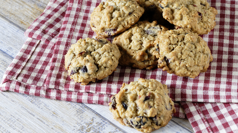 Oatmeal chocolate chip cookies on a plaid cloth