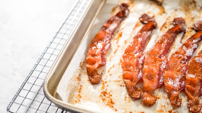 Bacon on parchment paper on sheet pan