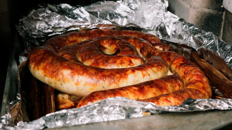 Spiral sausage cooking in an oven