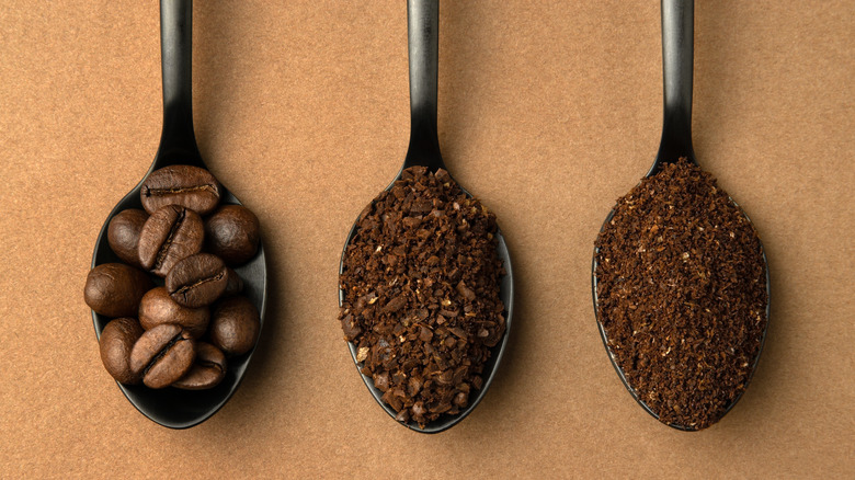 Spoons of coffee beans and grounds