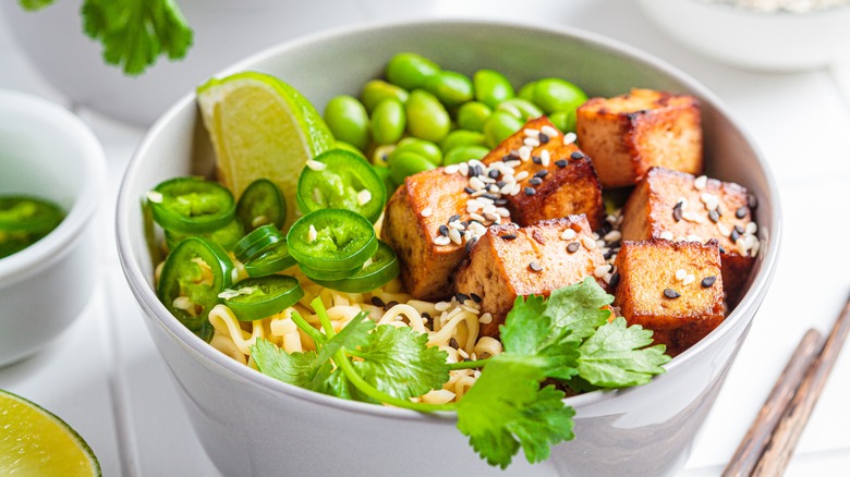 Tofu bowl with noodles and edamame