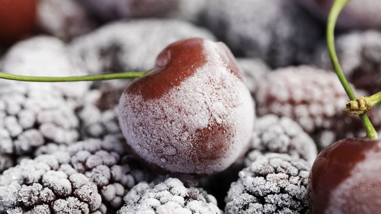 frozen cherry on top of frozen berries
