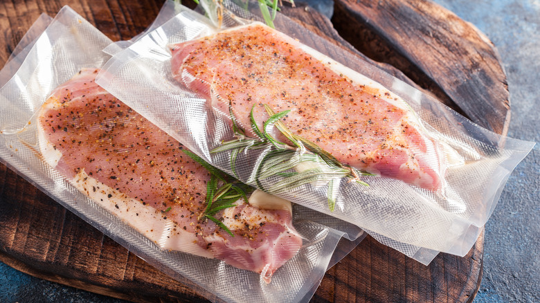 Two vacuum-sealed pork loin chops