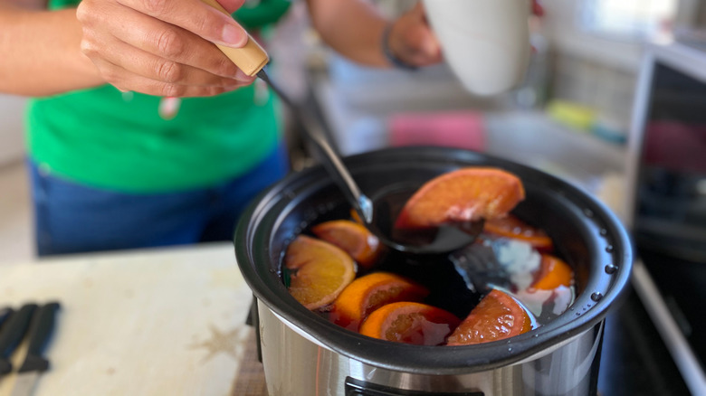 Mulled wine with orange in a slow cooker