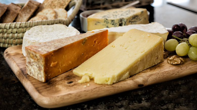 Strong cheeses on wood board