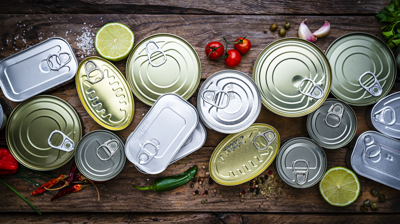 Overhead view of closed canned goods on table