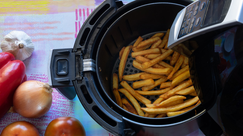 Top view of french fries inside of an air fryer