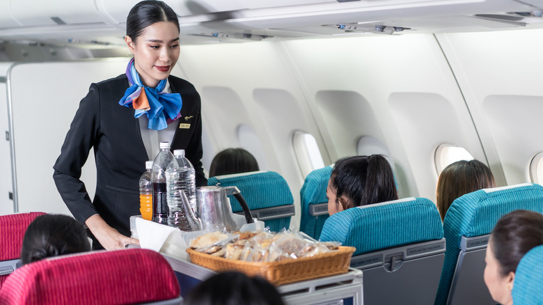 flight attendant serving food