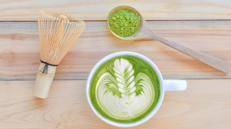 Matcha latte and bamboo whisk