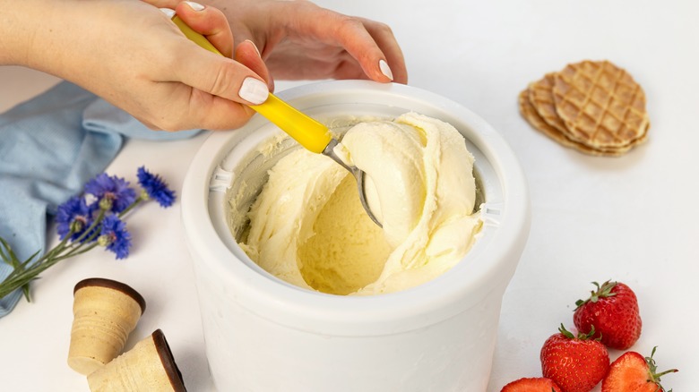 Scooping ice cream out of canister