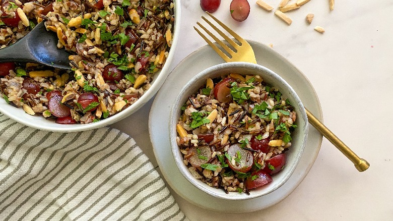 small bowl of wild rice with gold fork