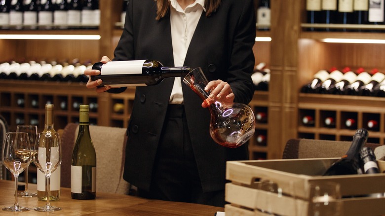 red wine being poured in decanter