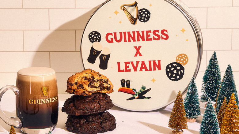 Guinness x Levain cookie tin, cookies, and mug of beer