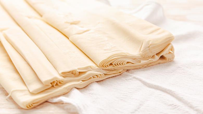 sheets of raw phyllo pastry dough