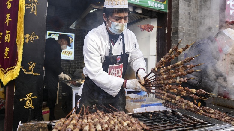 Chinese street vendor selling skewers