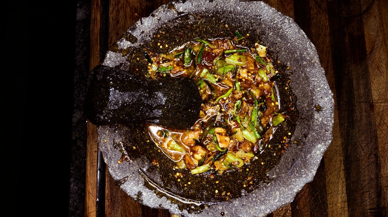 Making salsa in a molcajete