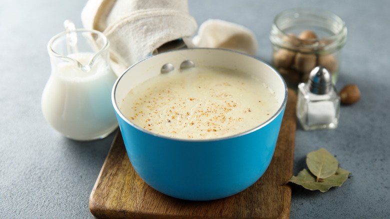 Bechamel sauce in pan with ingredients