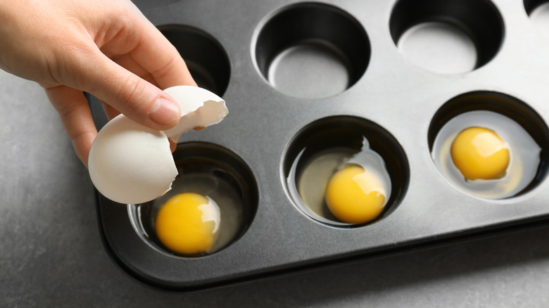 Cracking egg into mufifn tin