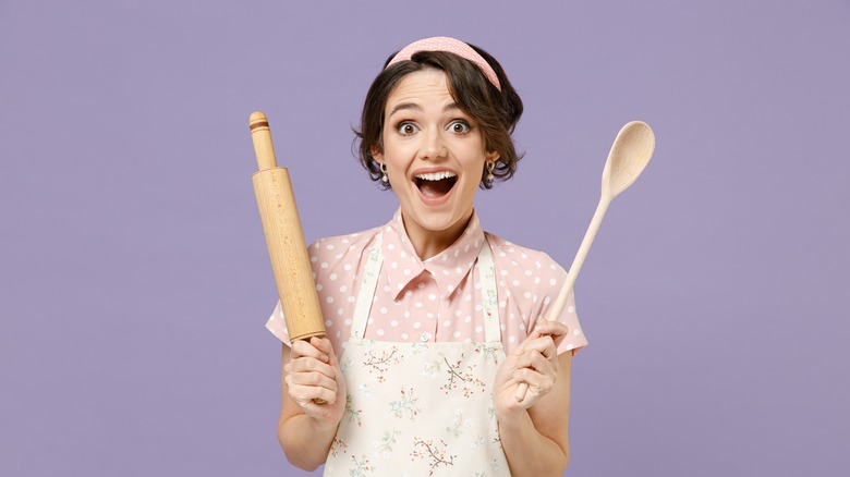 Woman with rolling pin, spoon 