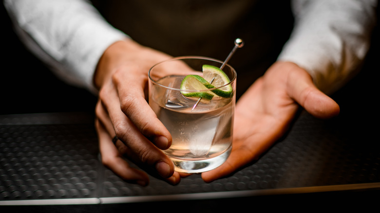 bartender holding cocktail