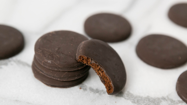 Thin mint cookies spread out with one missing a bite