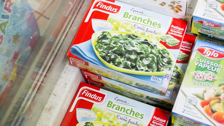 Packaged frozen spinach in the grocery store