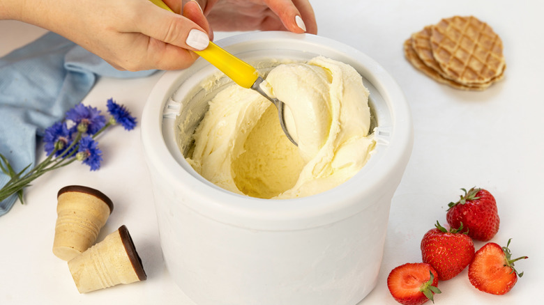 Making homemade vanilla ice cream in a machine