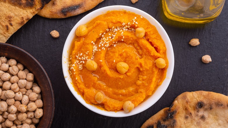 pumpkin hummus garnished with chickpeas