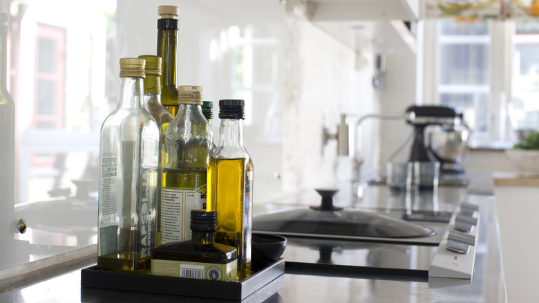 Bottles of olive oil on a clean kitchen countertop