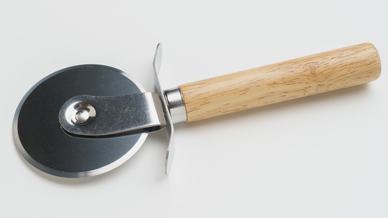 pizza cutter with a wooden handle