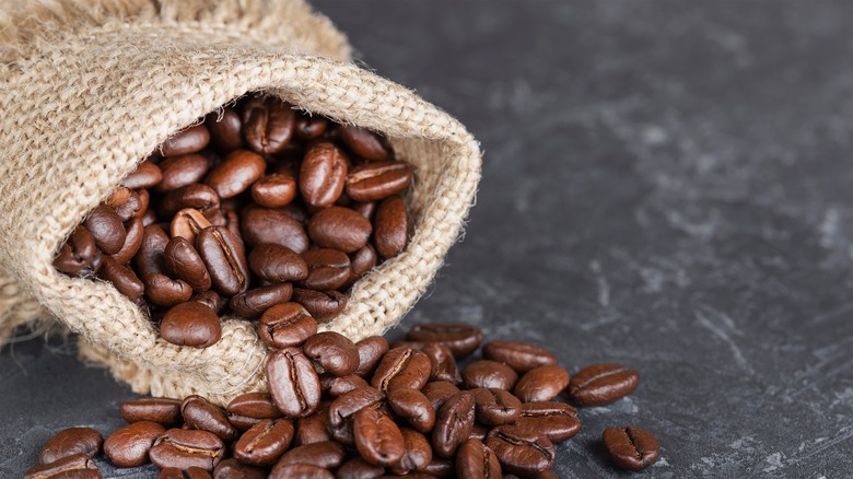 Coffee beans spilling out of bag