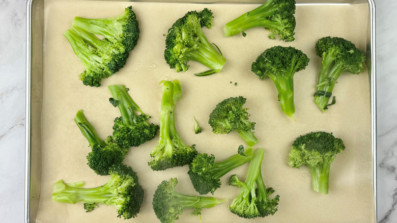 cooked broccoli on baking sheet