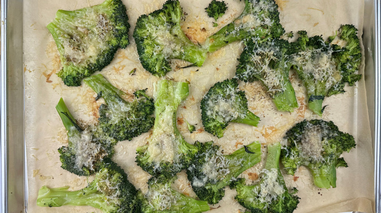 za'atar and parmesan smashed broccoli on baking sheet